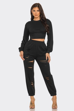Set de camiseta sólida de cuello redondo y pantalones cortados a láser